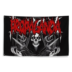 May include: Black and white flag with a red graphic of the word "PROPAGANDA" in a stylized font. A hooded figure with horns and a skull face is in the center of the flag.