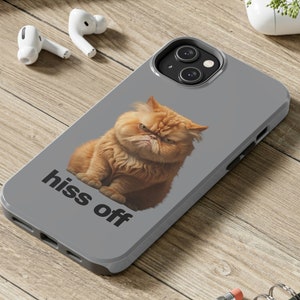 May include: A grey phone case featuring an orange cat with the text "hiss off" printed on it.