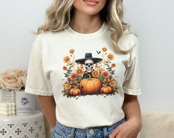 スケルトンパンプキンコンフォートカラーTシャツ、ボヘミアンパンプキンハロウィンシャツ、秋シーズンTシャツ、不気味なコテージコアTシャツ、魔女ガールズトップ