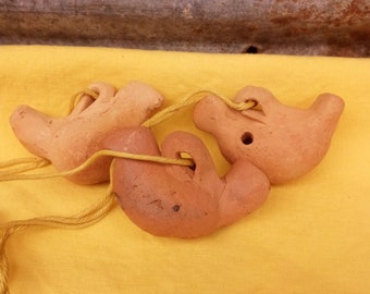 Primitive clay bird whistles