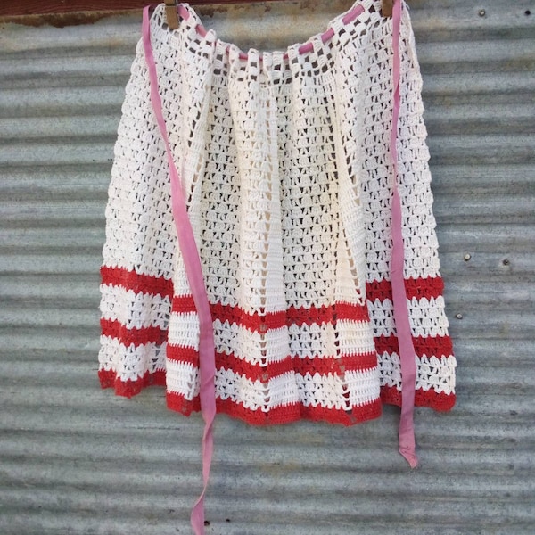 1960's vintage crocheted apron. Hand made, triple crochet, red and white pattern.