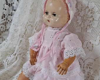 Vintage rubber, sleepy-eyed doll.