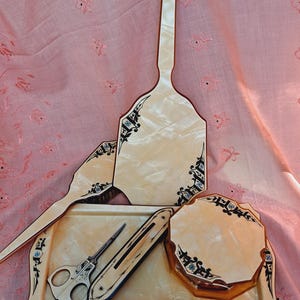 8-piece vintage plastic/bakelite vanity set.