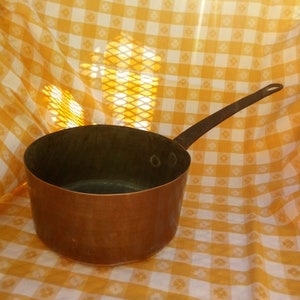 Vintage Copper saucepan with metal handle.