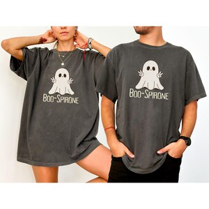May include: Two gray t-shirts with a cartoon ghost graphic and the text "Boo-Spirone".