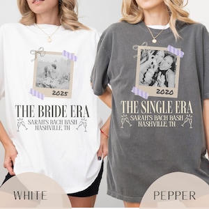 May include: Two t-shirts, one white and one pepper-colored, each featuring a photo-like graphic. The white shirt reads "THE BRIDE ERA" with "SARAH'S BACH BASH NASHVILLE, TN" below. The pepper shirt says "THE SINGLE ERA" with the same text.