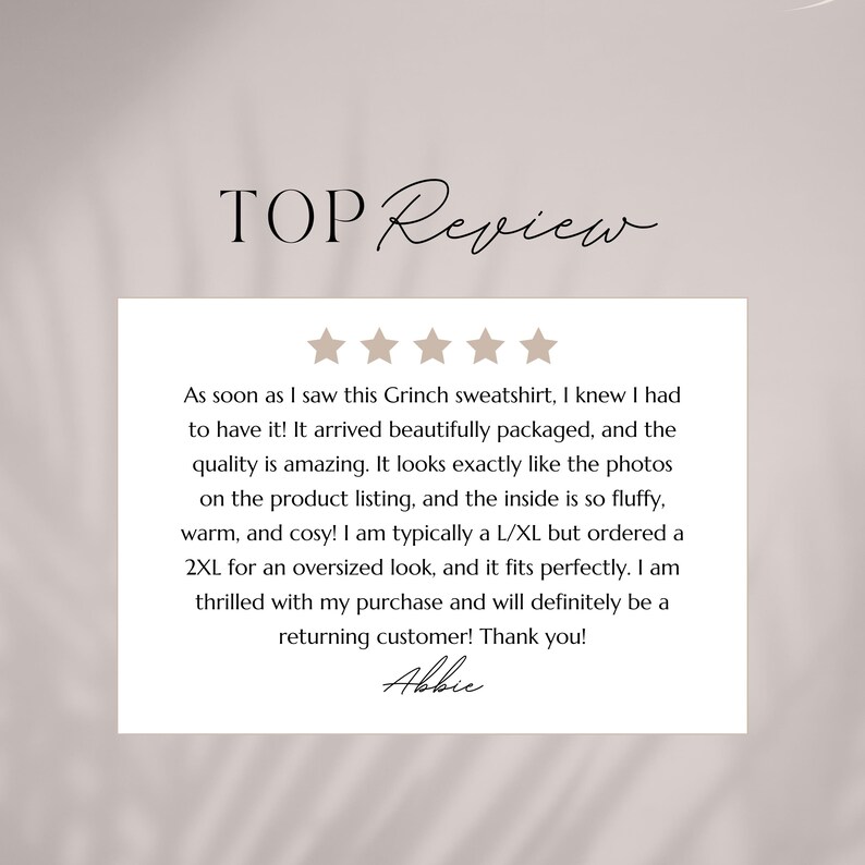 May include: A customer review card with the text "TOP Review" at the top. The review text mentions a Grinch sweatshirt, its quality, and fit. The review is signed by "Abbie".