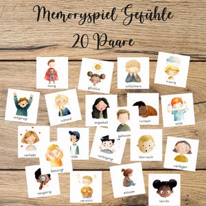 Könnte beinhalten: Ein Set aus 20 Paaren von Emotions-Lernkarten, mit Aquarellillustrationen von Kindern, die verschiedene Gefühle ausdrücken. Die Karten sind auf einer Holzoberfläche angeordnet, mit deutschem Text oben.