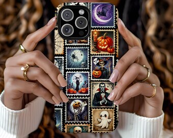 May include: A phone case featuring a collage of Halloween-themed postage stamp designs. The stamps depict pumpkins, bats, ghosts, and other spooky imagery in a variety of colors. The case is held by a person wearing a white sweater and gold rings.