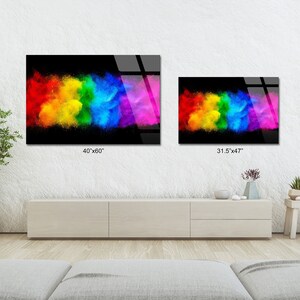 May include: Two colorful abstract art prints with a rainbow explosion of color on a black background. The larger print is 40 inches by 60 inches and the smaller print is 31.5 inches by 47 inches.