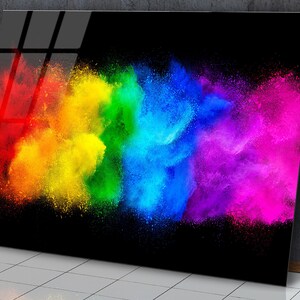 May include: A colorful abstract art print featuring a rainbow of colors in a cloud-like formation against a black background.