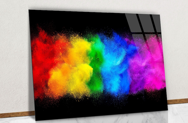 May include: Abstract art print featuring a colorful explosion of red, orange, yellow, green, blue, and purple powder on a black background.