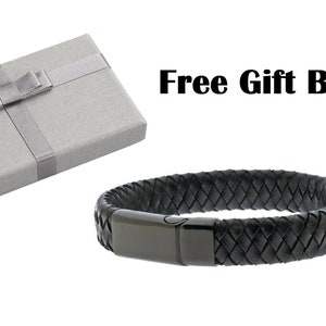 May include: Black leather bracelet with a black metal clasp. The bracelet comes in a grey gift box with a white ribbon.