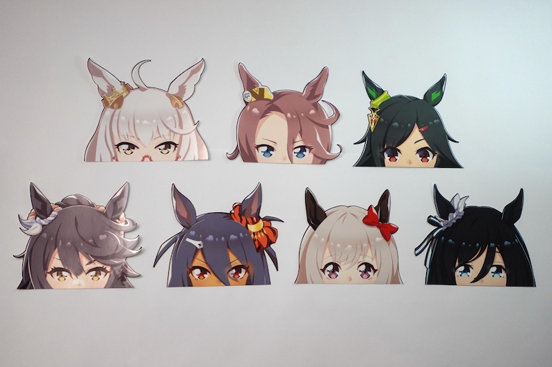 May include: A collection of eight anime-style stickers featuring stylized character faces with various hair colors and accessories. Each sticker has a unique design, with visible eyes and partial hairstyles.