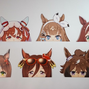 May include: Six anime-style character stickers featuring the top halves of the characters' faces. Each character has a unique hairstyle and eye color, with various accessories like bows and sunglasses. The stickers are designed with a white border.