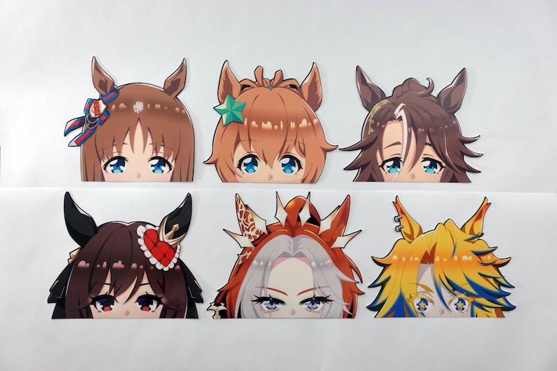 May include: Six anime-style character head cutouts with large eyes and various hair colors, including brown, orange, and yellow. Each cutout features a unique hairstyle and accessories, such as bows and stars.