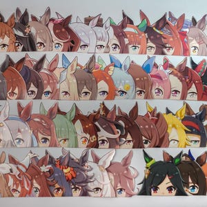 May include: A collection of anime-style character cutouts, each featuring a unique hairstyle and eye color. The characters are designed with horse ears and are arranged in neat rows. The color palette includes shades of brown, pink, blue, and green.