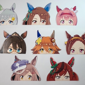 May include: A collection of anime-style character stickers, each featuring a close-up of a face with large eyes and stylized hair. The stickers have various hair colors and accessories, including bows and flowers.