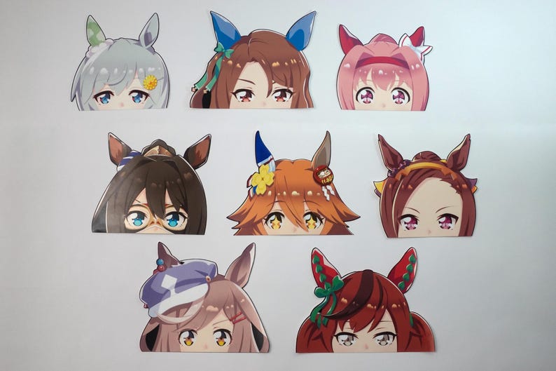 May include: A collection of anime-style character stickers, each featuring a close-up of a face with large eyes and stylized hair. The stickers have various hair colors and accessories, including bows and flowers.