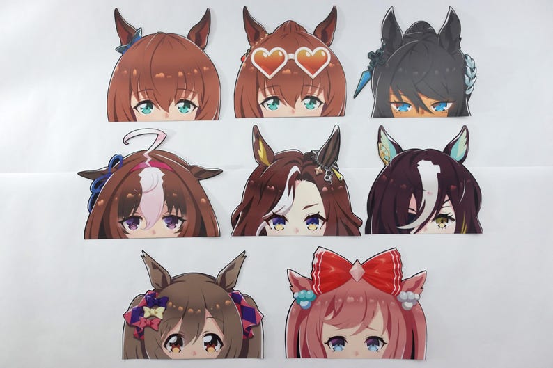 May include: A collection of anime-style character cutouts, each featuring a horse-eared girl with detailed eyes and hair. The characters have various hair colors, accessories, and expressions, including heart-shaped sunglasses and bows. The cutouts are on a white background.