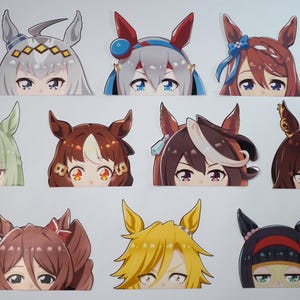 May include: A collection of ten anime-style stickers featuring characters with horse-like ears and various hair colors. Each sticker showcases a character's face, with detailed eyes and unique headwear, set against a white background.