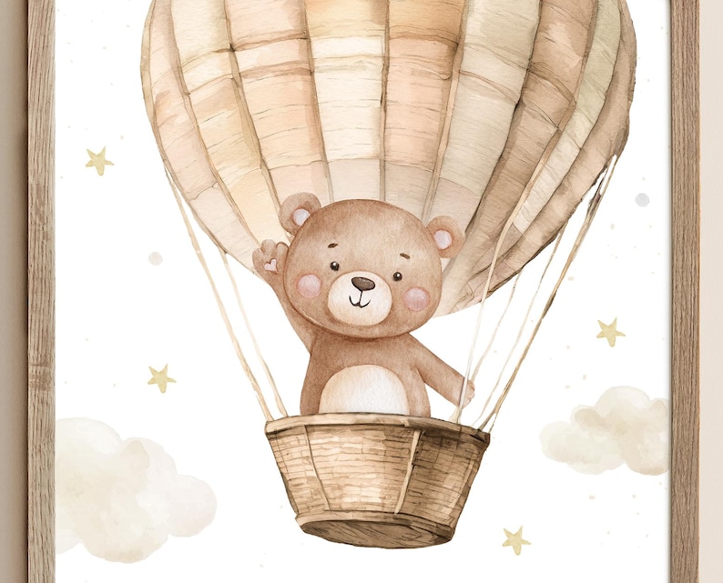 May include: Watercolor illustration of a teddy bear in a hot air balloon. The balloon is beige and brown, with the bear waving from a woven basket. Soft clouds and stars are scattered around the balloon, creating a whimsical scene. The artwork is framed.