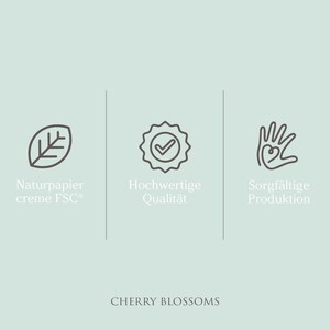 May include: A light teal background with three icons and text. The icons are a leaf, a badge with a checkmark, and a hand with a heart. The text includes "Naturpapier creme FSC", "Hochwertige Qualit&auml;t", and "Sorgf&auml;ltige Produktion". The words "CHERRY BLOSSOMS" are at the bottom.