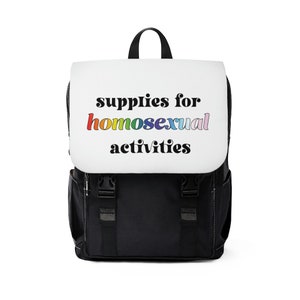 May include: Black backpack with a white front panel that says "supplies for homosexual activities" in rainbow letters.
