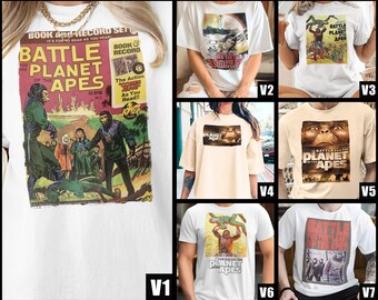 May include: White t-shirts featuring graphics from the movie "Battle for the Planet of the Apes." The designs include movie posters and comic book covers. The shirts are available in various styles and sizes.