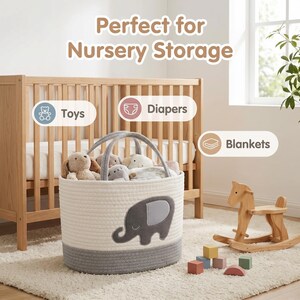 May include: A white and gray rope storage basket with an elephant applique, filled with plush toys. The basket has gray handles and a gray base. The text "Perfect for Nursery Storage" is at the top. A wooden rocking horse and blocks are in the background.