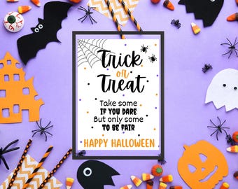 May include: A Halloween-themed image with a framed sign that reads "Trick or Treat." The sign is surrounded by Halloween decorations, including bats, spiders, candy corn, and a ghost, all on a purple background.