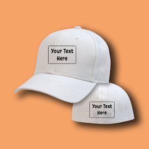 May include: Two white baseball caps with a black stitched border around the text "Your Text Here" on the front of each cap.