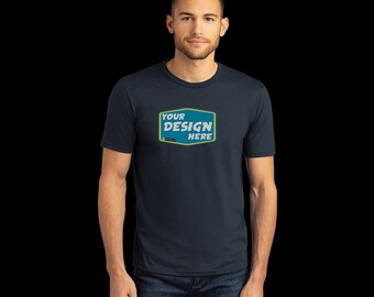 May include: A navy blue t-shirt with a yellow and blue rectangle on the front that says "YOUR DESIGN HERE".