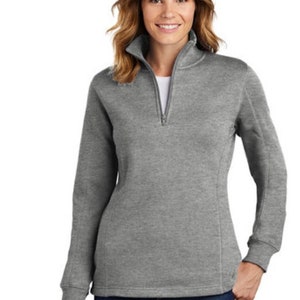 May include: A heather gray quarter-zip pullover sweater with long sleeves and a ribbed collar.