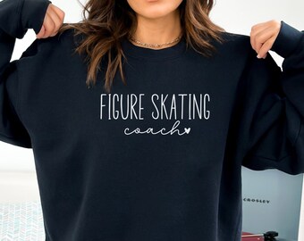May include: Black sweatshirt with white text that reads "FIGURE SKATING coach" with a small heart symbol.