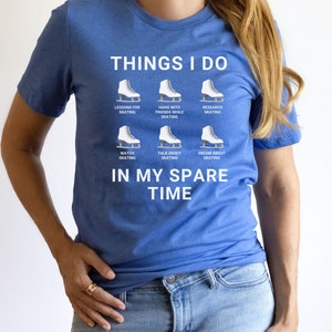 May include: A blue t-shirt with white text that reads "Things I do" and lists activities related to ice skating. The text includes "Lessons for skating", "Hang with friends while skating", "Research skating", "Watch skating", "Talk about skating", and "Dream about skating". The text concludes with "In my spare time".