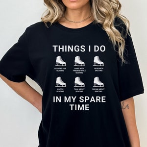 May include: Black t-shirt with white text that reads "Things I do" and a list of activities related to ice skating. The activities include "Lessons for skating", "Hang with friends while skating", "Research skating", "Watch skating", "Talk about skating", and "Dream about skating". The text "In my spare time" is below the list.