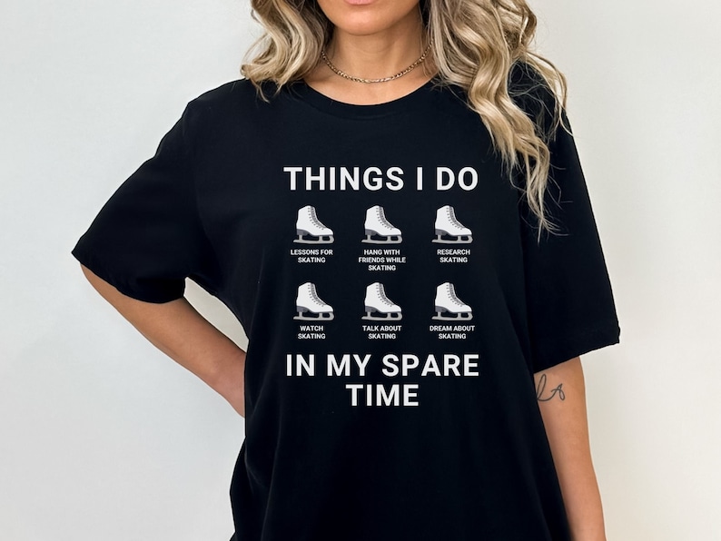 May include: Black t-shirt with white text that reads "Things I do" and a list of activities related to ice skating. The activities include "Lessons for skating", "Hang with friends while skating", "Research skating", "Watch skating", "Talk about skating", and "Dream about skating". The text "In my spare time" is below the list.
