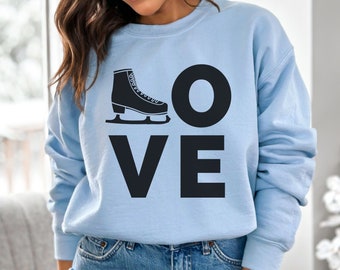 May include: A light blue sweatshirt with the word "LOVE" in black block letters. A black ice skate graphic replaces the "O" in "LOVE". The sweatshirt is a solid light blue color.