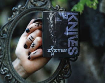 SYSTEM SYN Knives Coffee Mug - officially licensed coffee cup