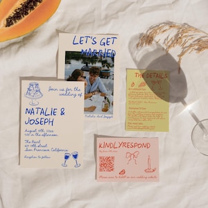 May include: A wedding invitation suite featuring several cards. One card displays "LET'S GET MARRIED" above a photo. Another card reads "NATALIE & JOSEPH" with event details. A third card says "THE DETAILS". A fourth card says "KINDLYRESPOND". A slice of papaya and a glass are also present.