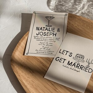 May include: Two wedding invitation cards with black text on a cream background. One card says "Natalie & Joseph" with event details and a martini illustration. The other says "Let's Get Married" with a cake illustration.