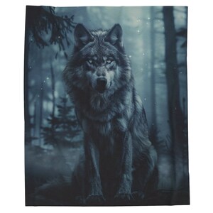 May include: A grey wolf sits in a misty forest with a blue-toned background. The wolf has piercing blue eyes and is looking directly at the viewer.