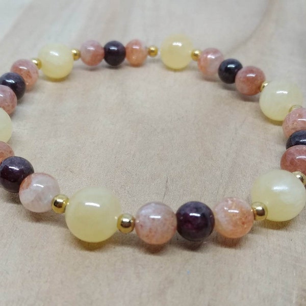 Bracelet de lithothérapie en calcite jaune, pierre de soleil et grenat.