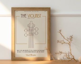 May include: A framed print titled "The Violinist" featuring a line drawing of a violin's headstock and strings. The print has a beige background with gold accents and a quote by Yehudi Menuhin. The frame is made of light-colored wood.