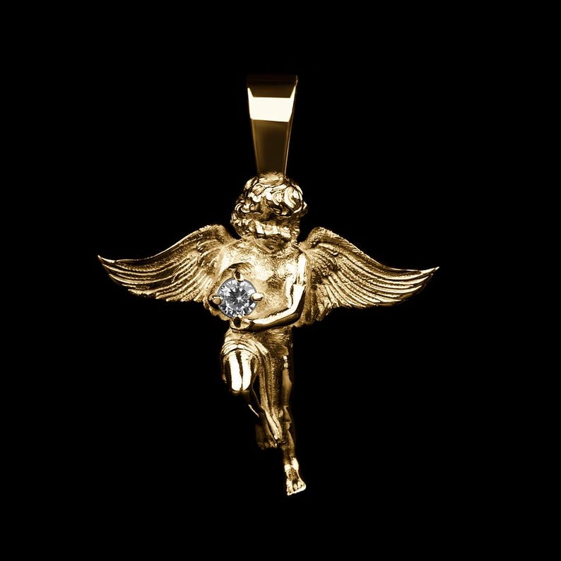 A delicate gold-plated angel cupid necklace with cherub charm, handmade baby angel pendant symbolizing protection and love — ideal for religious wearers and meaningful gifts.