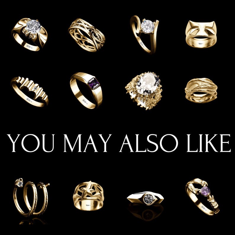 May include: A collection of gold rings with various designs and gemstones, including diamonds, sapphires, and a heart-shaped design. The rings are displayed on a black background. You May Also Like.