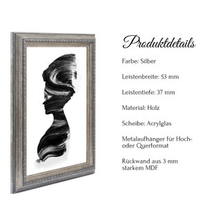May include: A silver framed picture with a black and white abstract portrait of a woman. The frame is 5.3 inches wide and 3.7 inches deep. The picture is made of wood and has an acrylic glass front. It includes a metal hanger for hanging in portrait or landscape orientation. The back is made of 3 mm thick MDF.