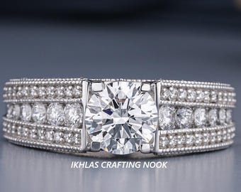 Anillo de compromiso de plata de ley con moissanita certificada GRA y diseño milgrain.