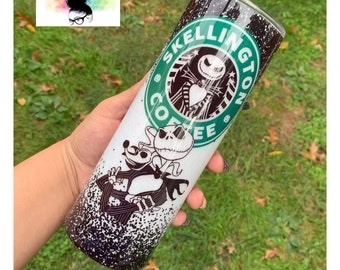 May include: A white and black stainless steel tumbler with a green and black design featuring the text "SKellington Coffee" and a cartoon image of Jack Skellington from the Nightmare Before Christmas.